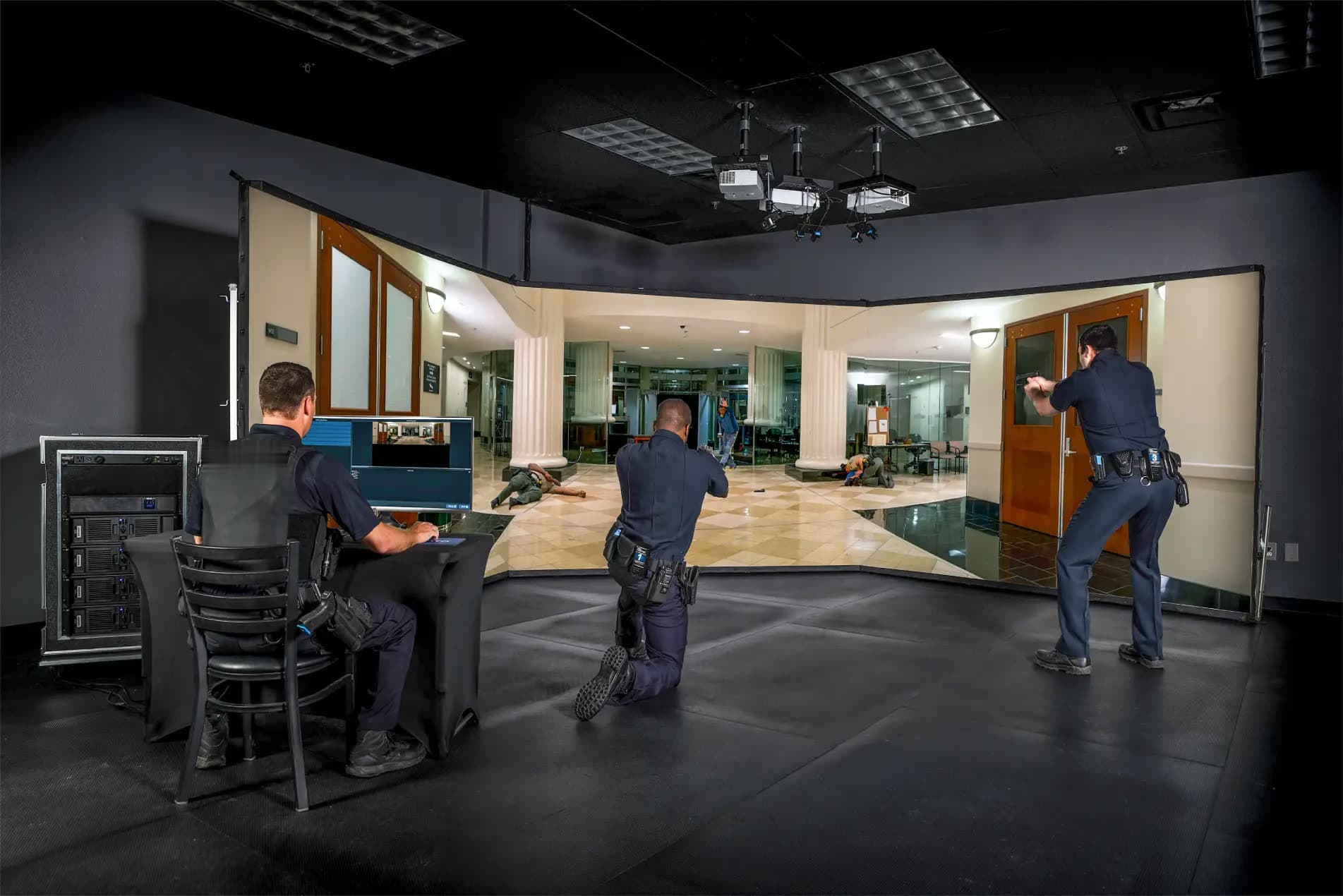 Officers training tactical response on the immersive firearms training simulator