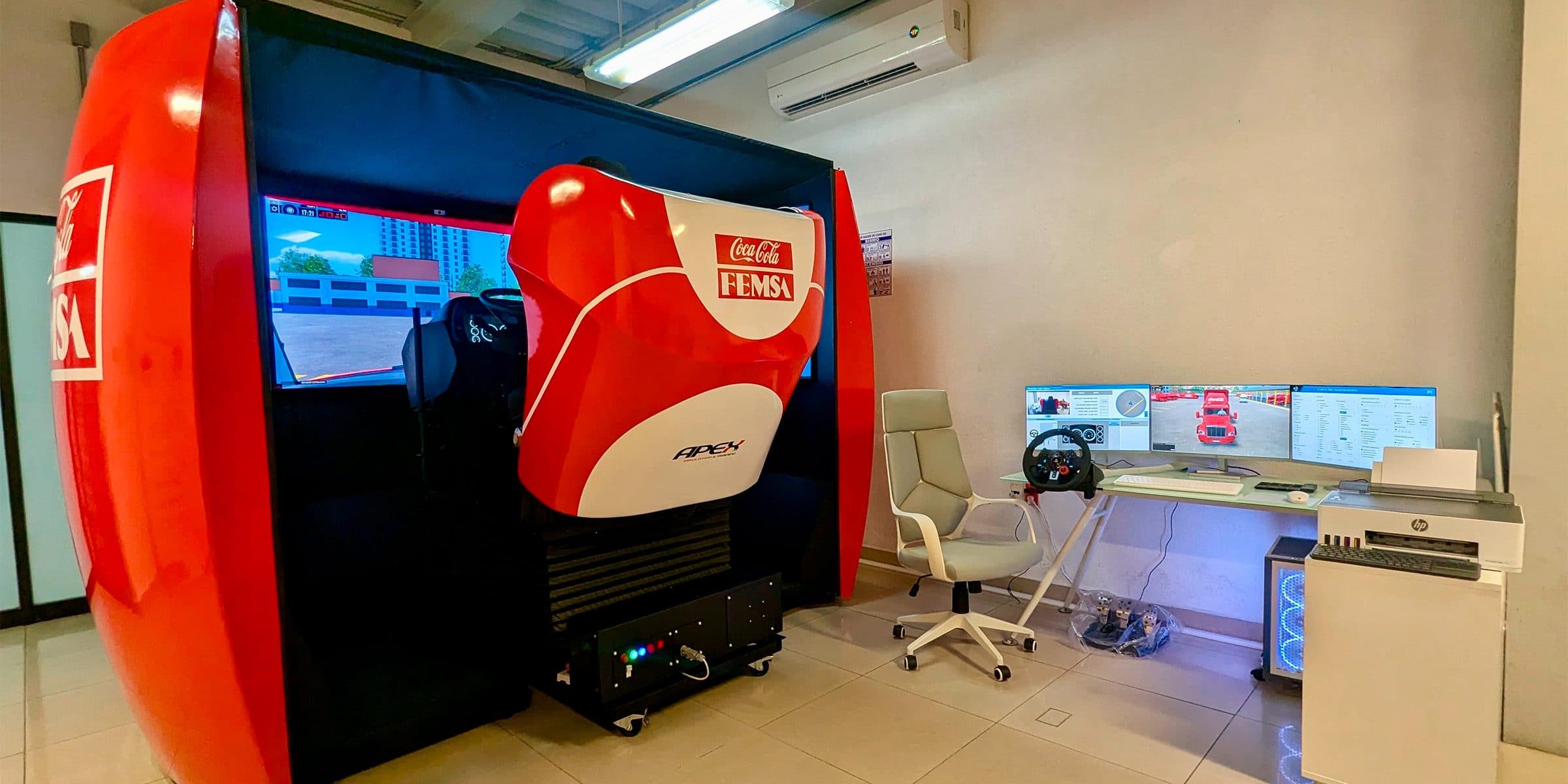 Real truck cab of the APEX simulator: steering wheel, shifter, pedals, and dashboard