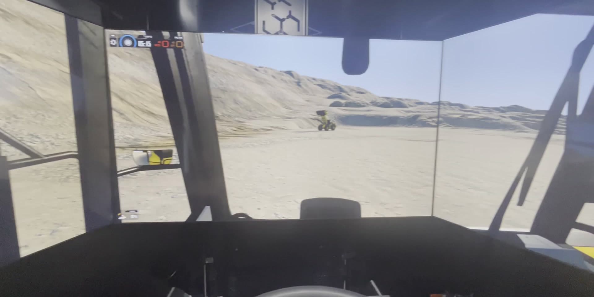 Cabina del simulador de camión minero con volante y tablero digital reales